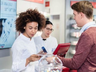 Dedicated female pharmacist checking a medical prescription