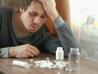 Man has a lot of pills and falls asleep