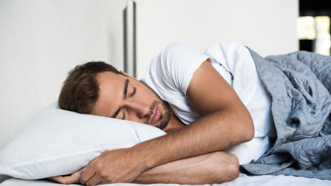 Attractive young man sleeping