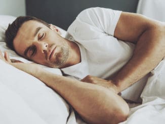 Handsome Man Sleeping in His Soft Bed