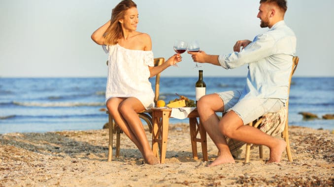 Young couple with glasses of wine