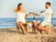 Young couple with glasses of wine