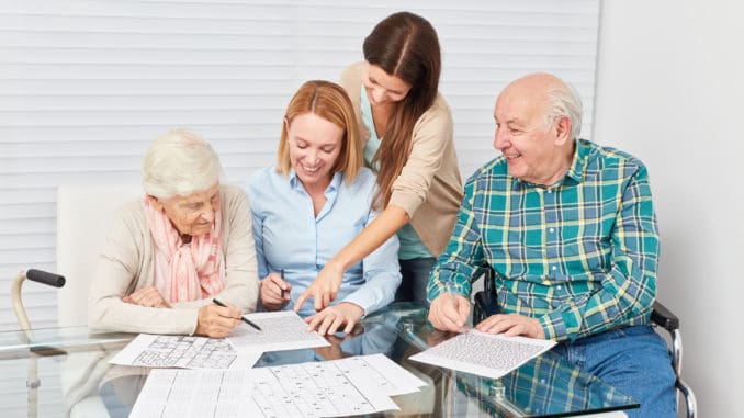 Family with seniors couple together makes memory training