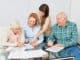 Family with seniors couple together makes memory training