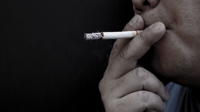 dreamstime_m_139938885 Man smoking a cigarette