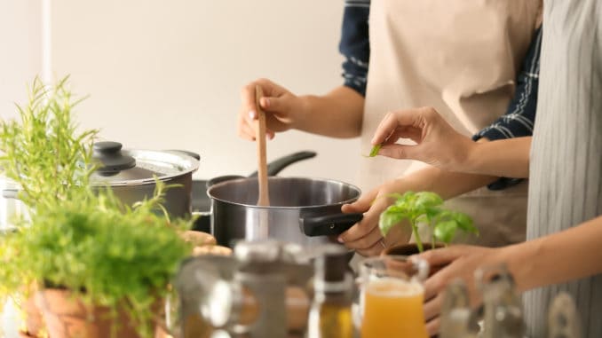 Women cooking together in kitchen