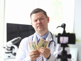 counting earned money in front of videocamera.