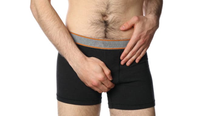 dreamstime_m_178697944 Man holding his groin, isolated on background. Men`s health