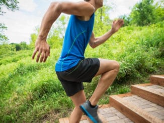 Close-up Of Man Jogging On The Staircase