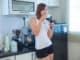 Young asian woman drinking coffee in the morning at home