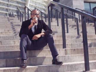 man drinking coffee during a lunch