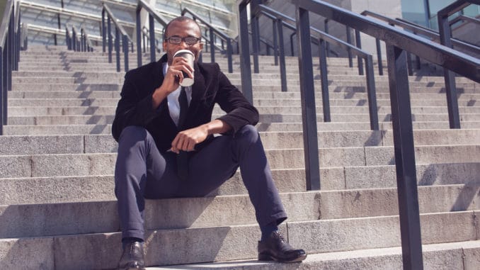 man drinking coffee during a lunch