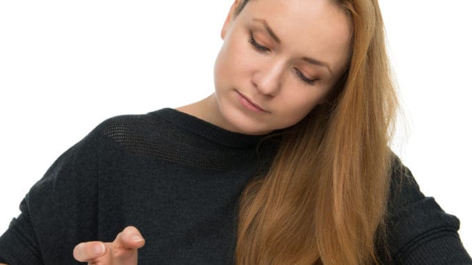 Diabetic patient measuring glucose level blood test using ultra mini glucometer