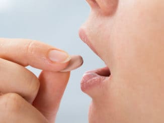 Person Taking Medicine Pill