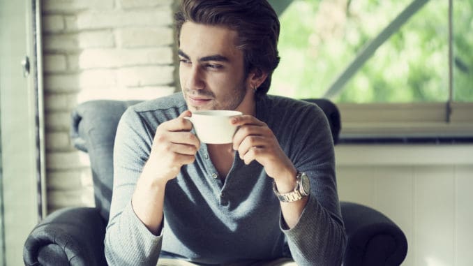 dreamstime_m_60844824 Young man drinking coffee in cafe