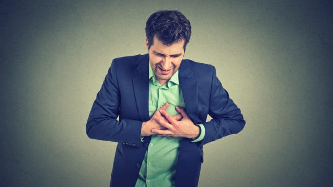 dreamstime_m_69939236 Adult man suffering from severe sharp heartache, chest pain