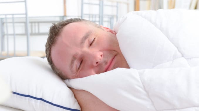 Man peacefully sleeping at home