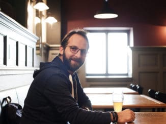 Man drinking beer in a pub in Prague