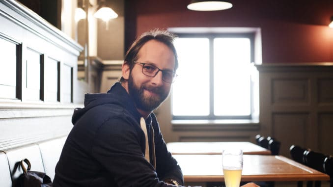 Man drinking beer in a pub in Prague