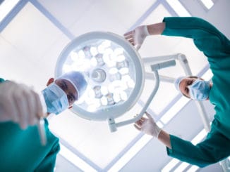 Surgeons operating in operation theater in hospital