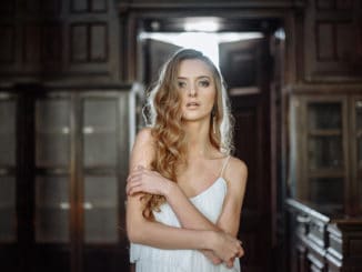 Indoor summer portrait of young pretty cute girl.