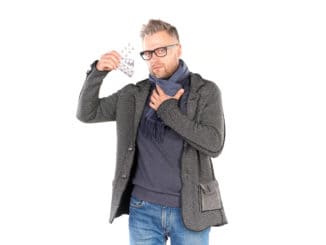 man wearing warm scarf and holding pills