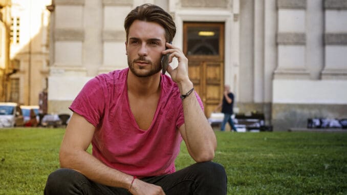 One handsome young man in urban setting in European city