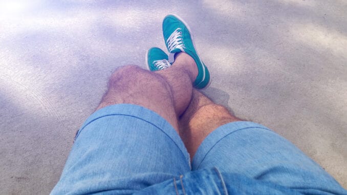 dreamstime_s_115264456 Man with hairy legs in denim shorts