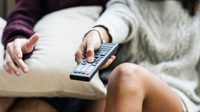 dreamstime_s_116684842 Couple watching a tv show together
