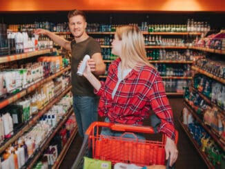 Young couple in grocery store.