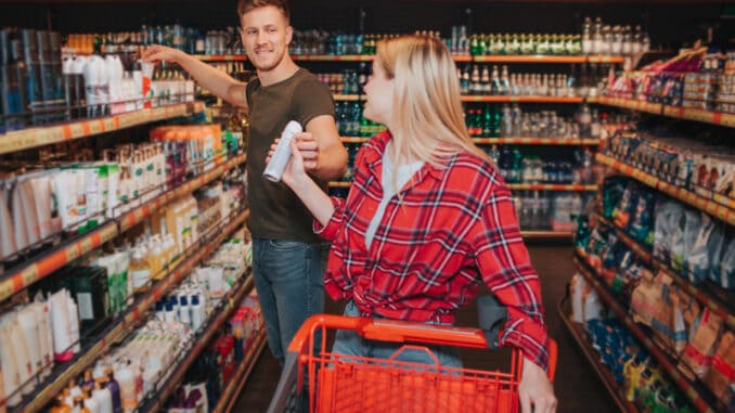 Young couple in grocery store.