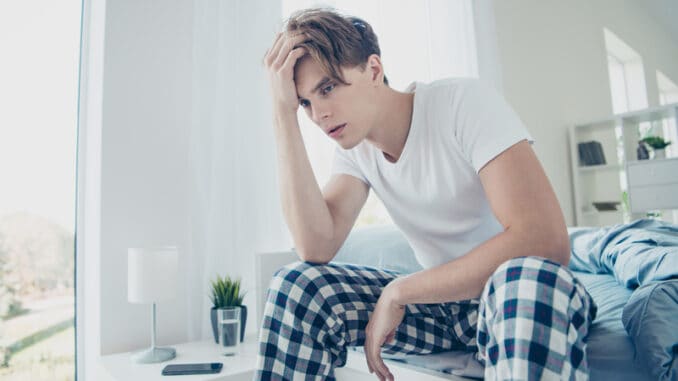 dreamstime_s_159915581 Portrait of unhappy unwell man after hangover party suffer terrible,