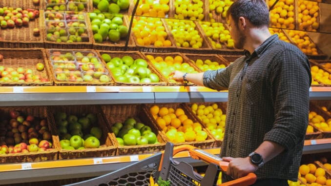 dreamstime_s_161279924 man in grocery store do shopping buying fruits copy space