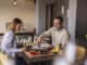 Beautiful couple on a date at restaurant, eating lunch and having fun