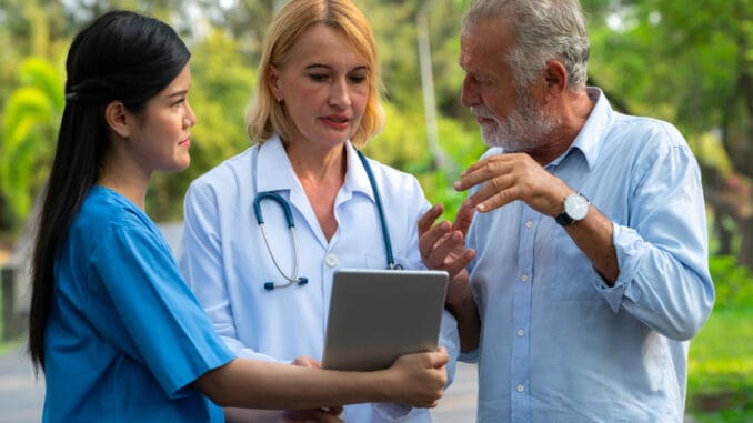 Senior man talking to doctor