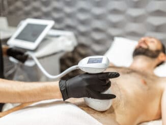 Man during an ultrasound liposuction procedure at luxury Spa salon