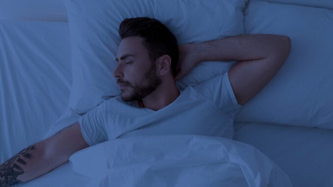 dreamstime_s_221949845 Young man sleeping peacefully at night