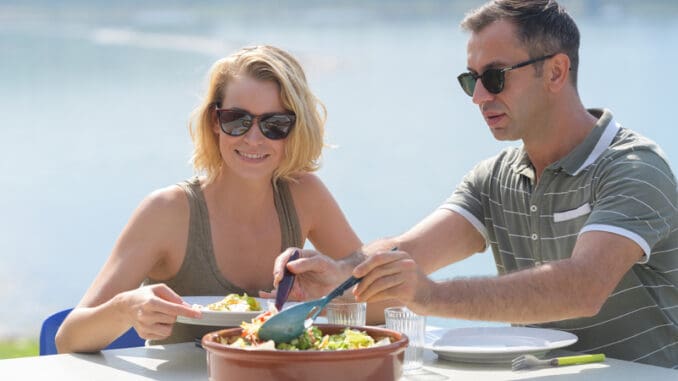 romantic couple having lunch outdoor