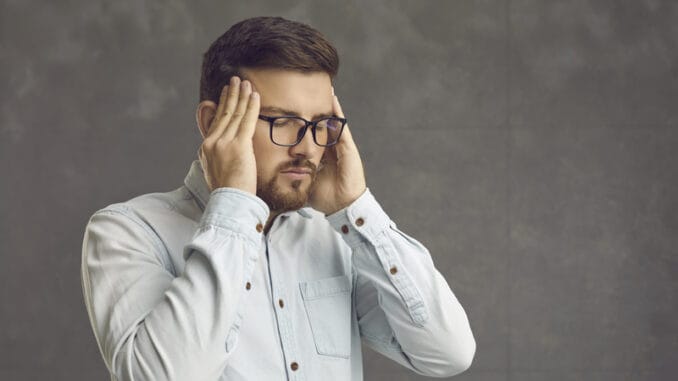 dreamstime_s_230150385 Young man relieving stress and restoring energy levels.