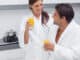 Couple drinking orange juice in the kitchen