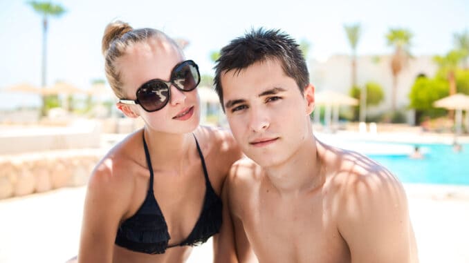 Summer vacation couple on sunny day in tropical resort