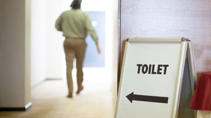dreamstime_s_50735890 Man going to public toilet