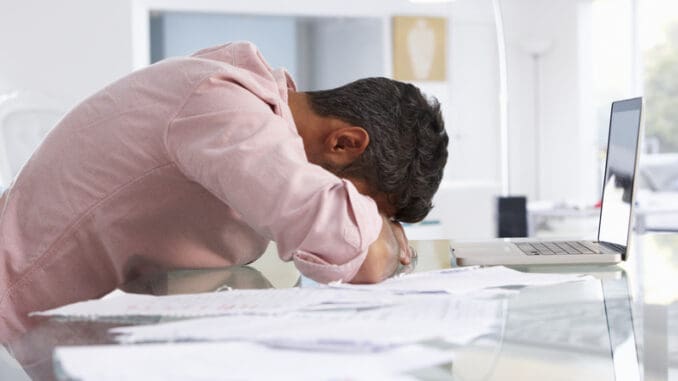 dreamstime_s_54971894 Stressed Man Working At Laptop In Home Office