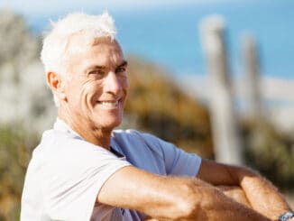 Portrait of healthy senior man smiling at camera