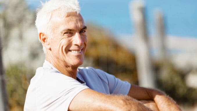 Portrait of healthy senior man smiling at camera