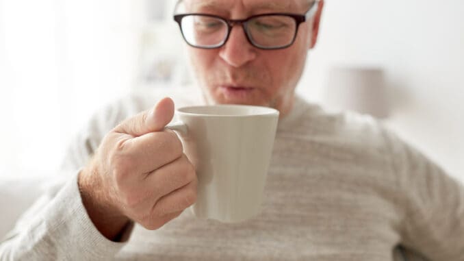 happy senior man drinking tea