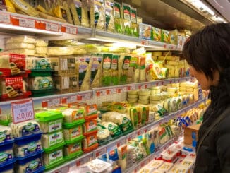 Young brunette woman shopping in supermarket