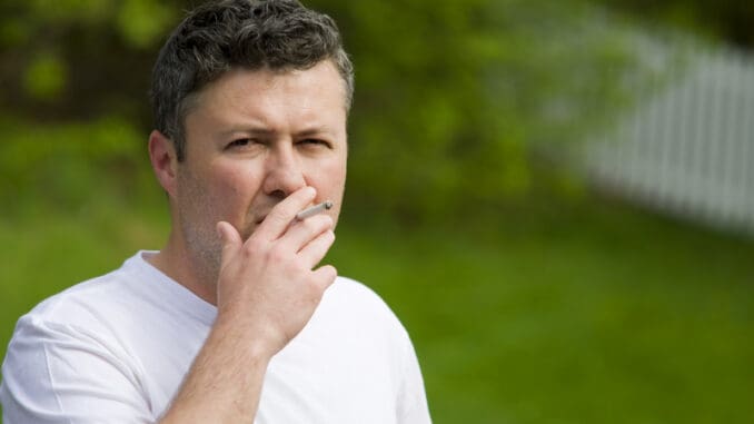 dreamstime_s_9450678 Portrait of a handsome middle eastern man smoking
