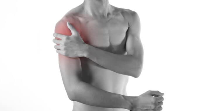 Young man arm and shoulder joint pain on white background.